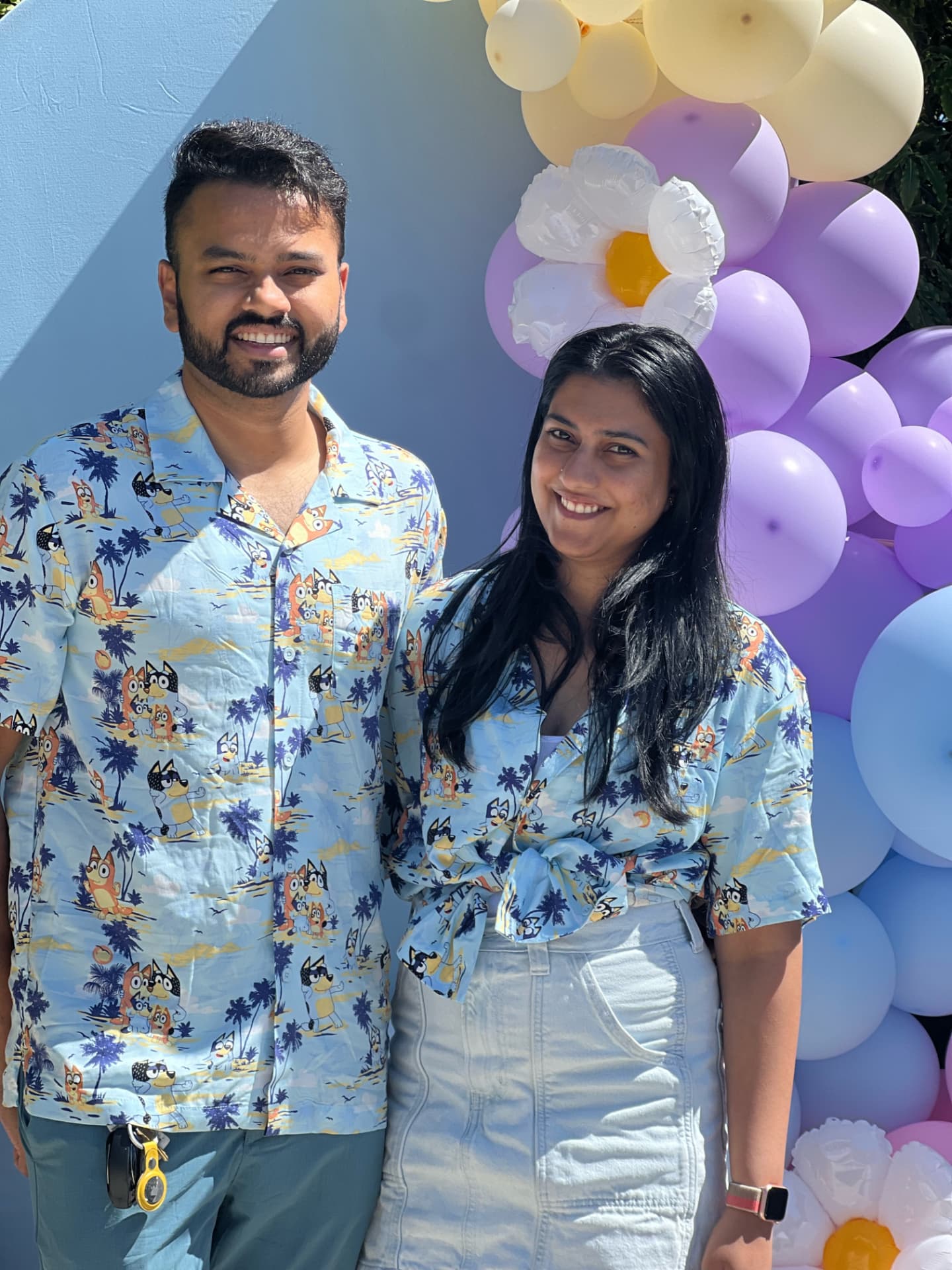 Two Bluey shirts, one happy face, design detail from a Katha Clicks celebration