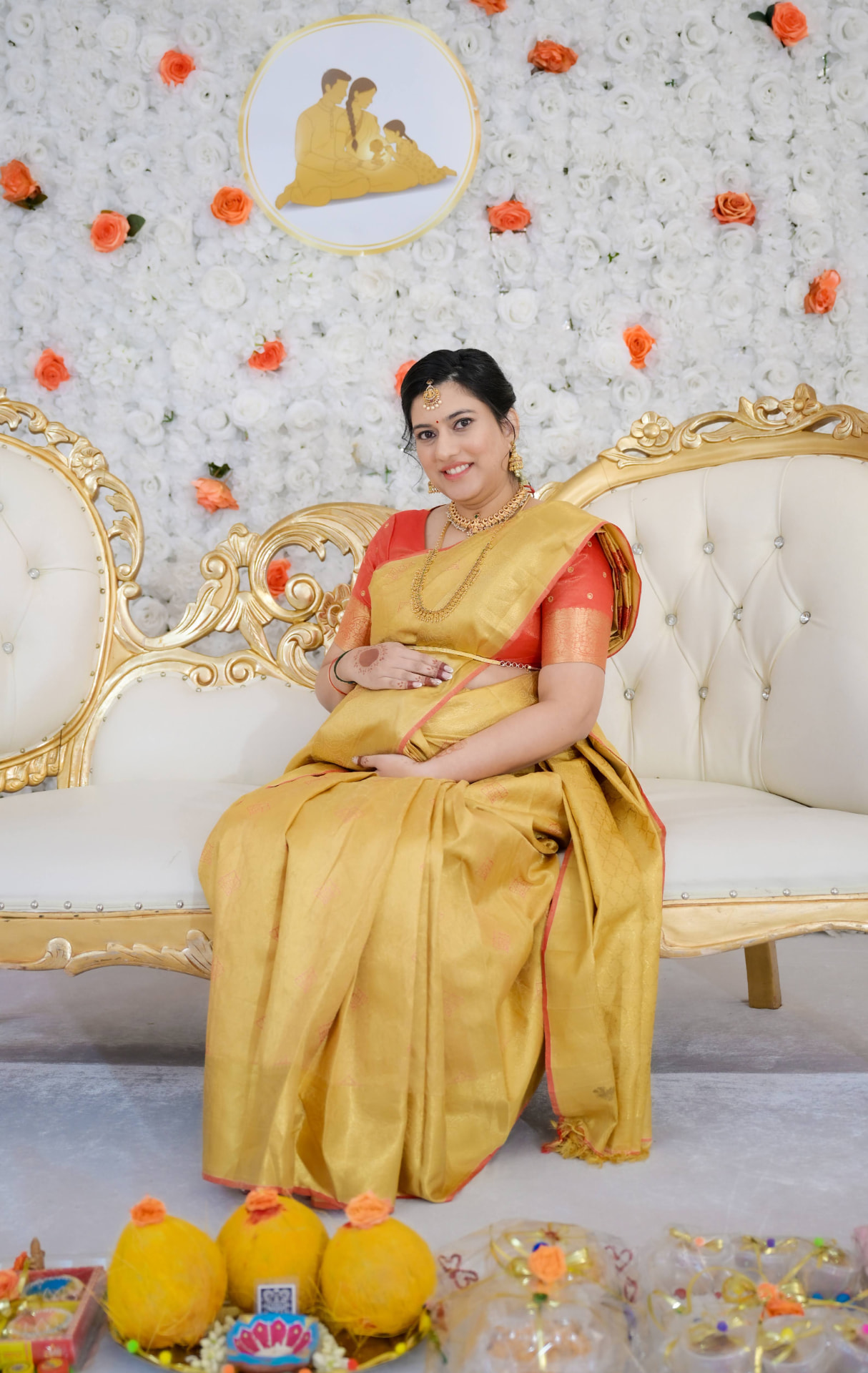 The mom-to-be, seated in state, milestones detail from a Katha Clicks celebration
